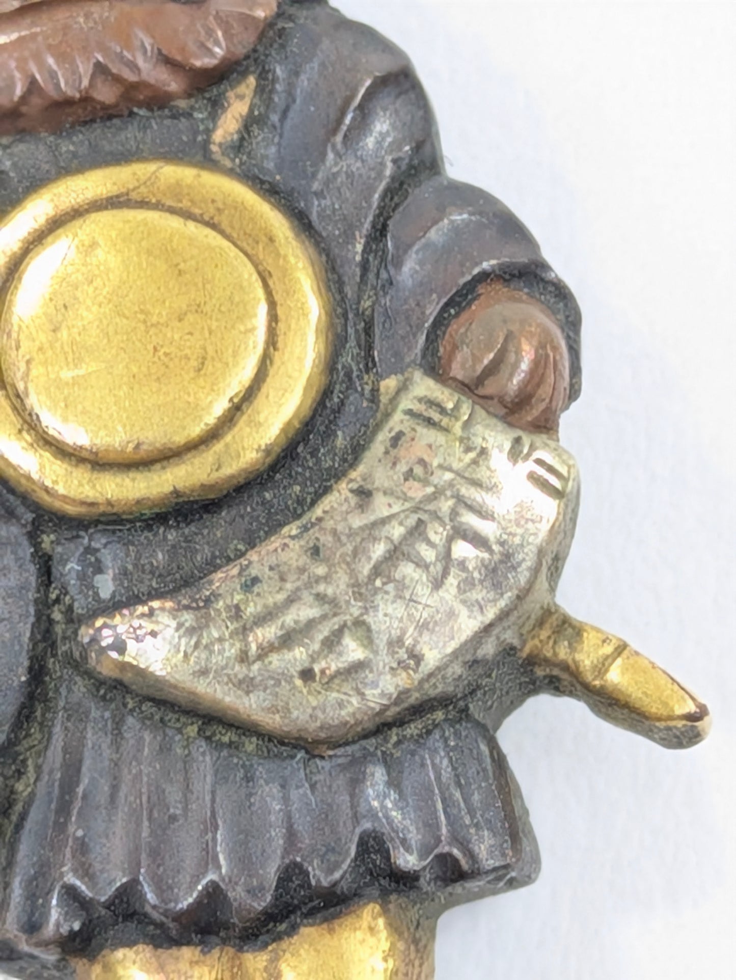 Menuki Oni Dressed as Monk with Drum and Scroll Japan, Edo period, mixed-metal with gilt highlights LS108