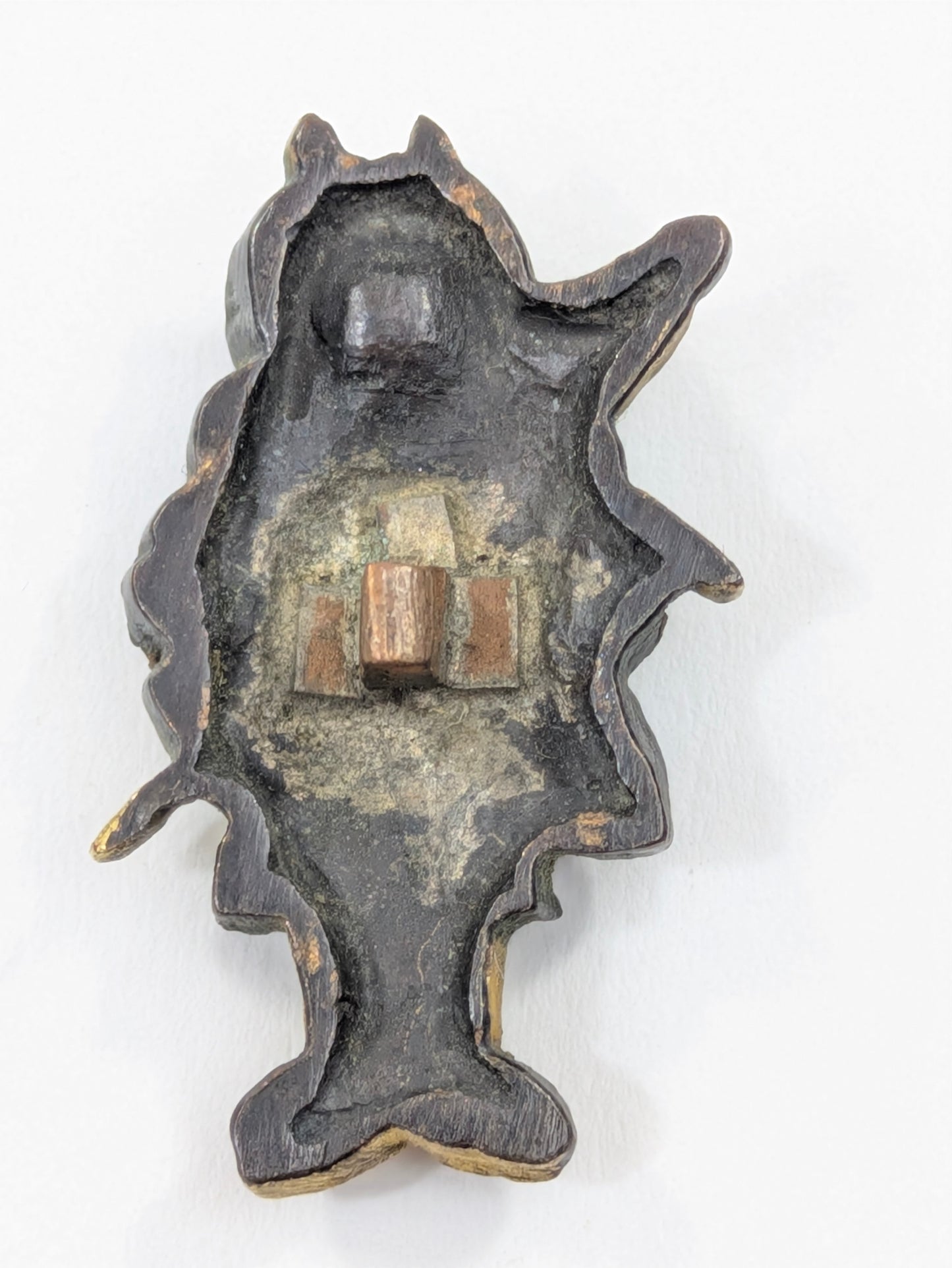 Menuki Oni Dressed as Monk with Drum and Scroll Japan, Edo period, mixed-metal with gilt highlights LS108