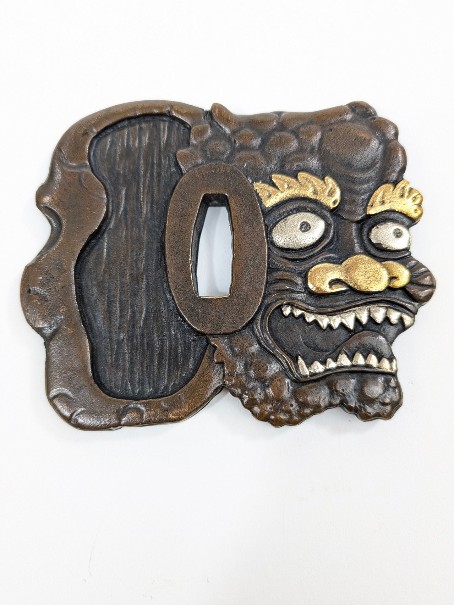 Decorative Tsuba Oni Mask Motif Japan, 20th (after Edo period) Cast iron gilt silvered details LS179