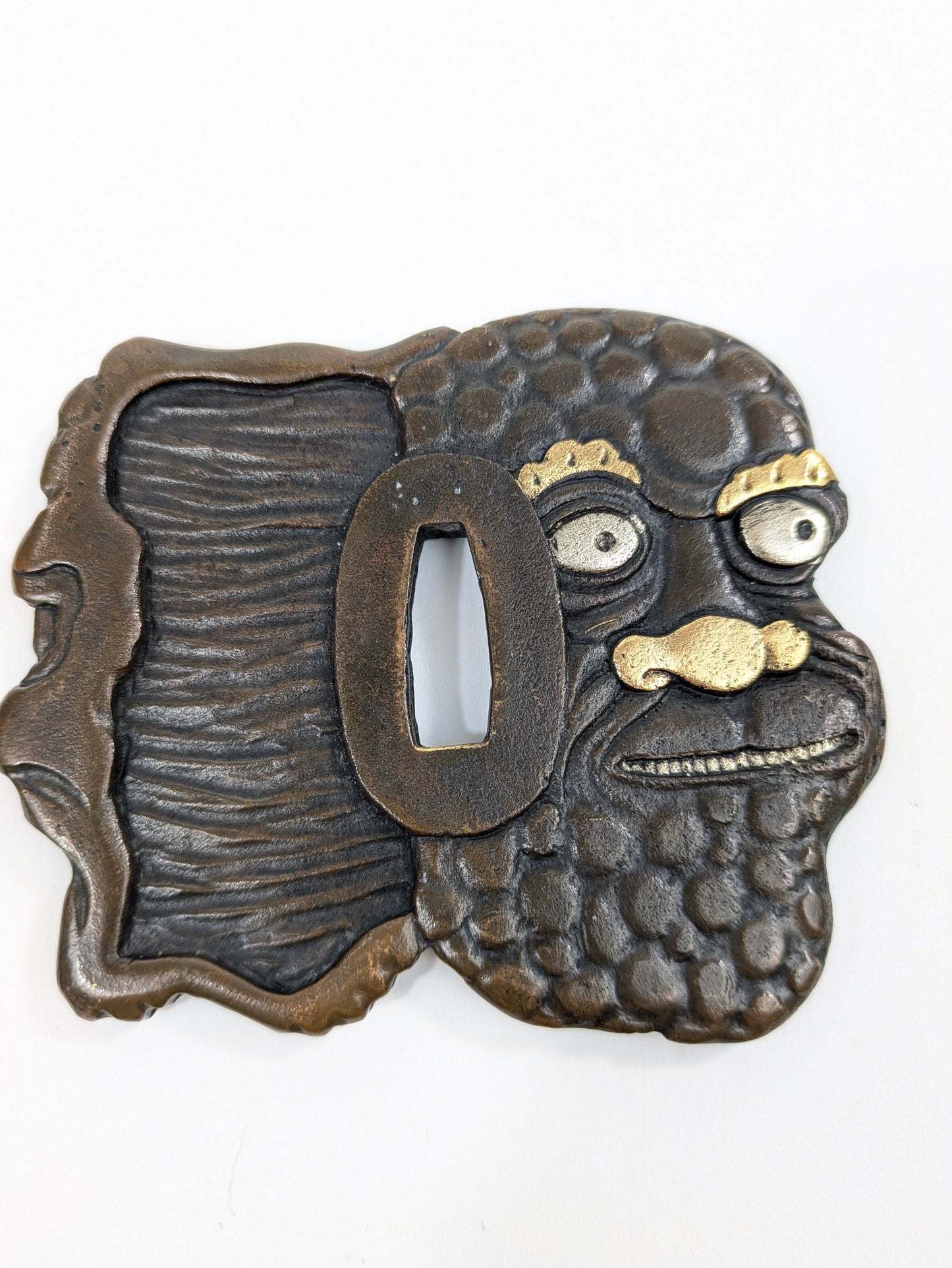 Decorative Tsuba Oni Mask Motif Japan, 20th (after Edo period) Cast iron gilt silvered details LS179