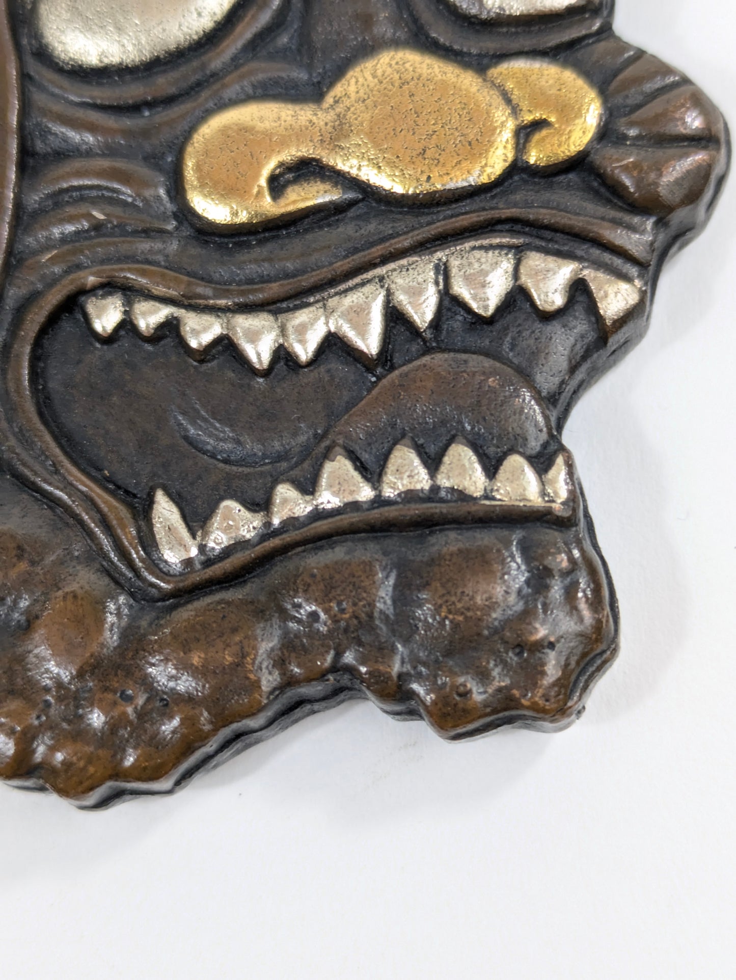 Decorative Tsuba Oni Mask Motif Japan, 20th (after Edo period) Cast iron gilt silvered details LS179
